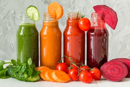 Selection of colorful vegetable juices in glass jars